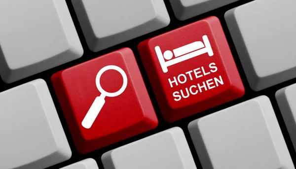Komputerowa klawiatura z niemieckim tekstem znaczenie Szukaj hoteli - — Zdjęcie stockowe