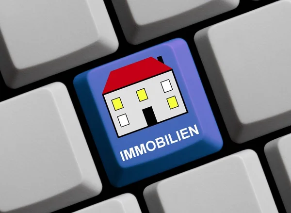 Symbol auf der Computertastatur Immobilien in deutscher Sprache — Stockfoto