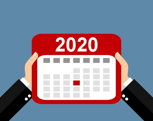 Two hands holding calendar showing appointments and events in 2020 — Stock Photo, Image