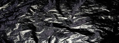 Buruşmuş siyah folyo arkaplan dokusu