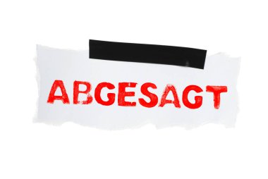 White isolated paper with black adhesive tape showing Cancelled in german language clipart