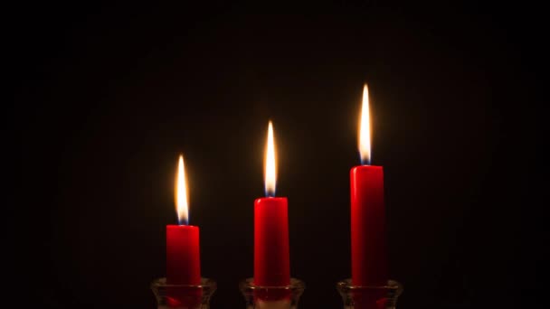 Three Red Candles Burning Out — Stock Video