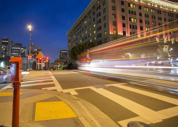 Road with tramway in san francisco at night