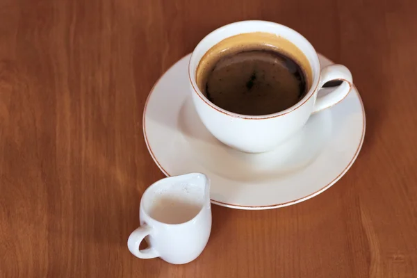 Cup of coffee and milk on the table — Stock Photo, Image