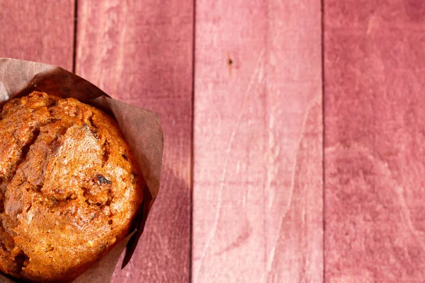 Chocolate muffins in the dark paper. — Stock Photo, Image