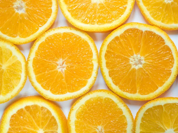 Streszczenie tła z owocami cytrusowymi plasterków pomarańczy. Zbliżenie. — Zdjęcie stockowe