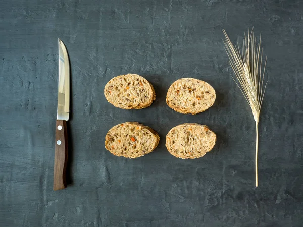 Grain bread on dark background. The view from the top. — Stock Photo, Image