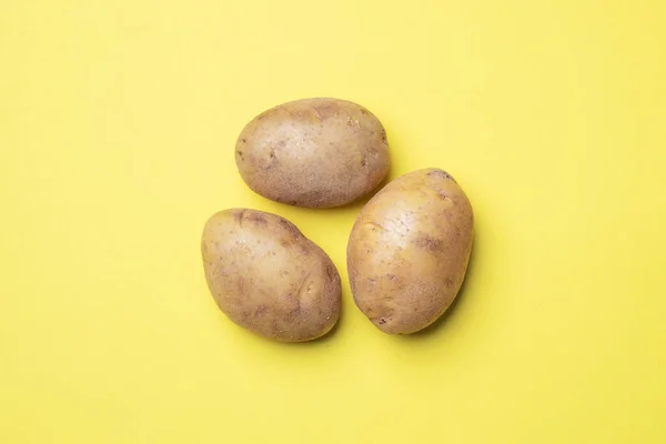 Raw Potato Tubers Yellow Background — Stock Photo, Image