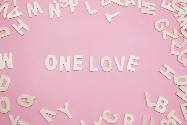 Sorting letters One love on pink. — Stock Photo, Image