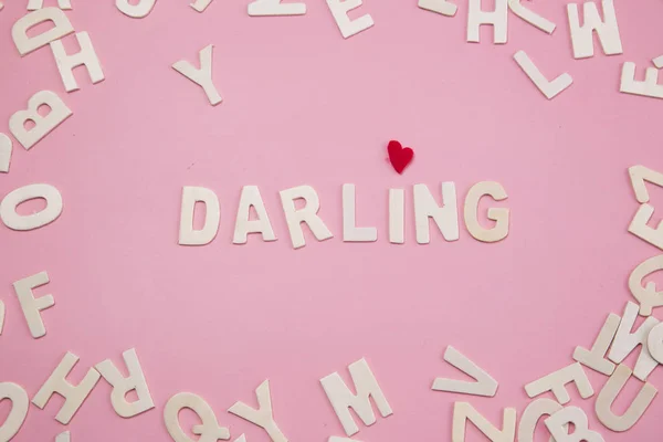 Sorting letters Darling on pink. — Stock Photo, Image