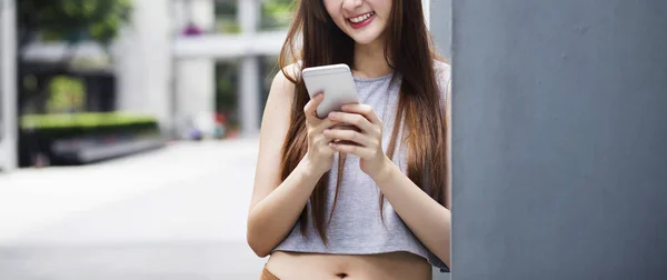 Young asian woman use smartphone — Stock Photo, Image