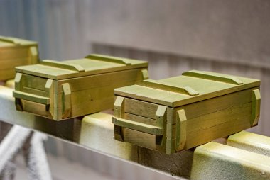 Military style souvenir boxes in paint booth