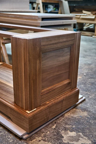 Dresser elements in a workshop. Solid wood chest of drawers. Furniture manufacture. Close-up