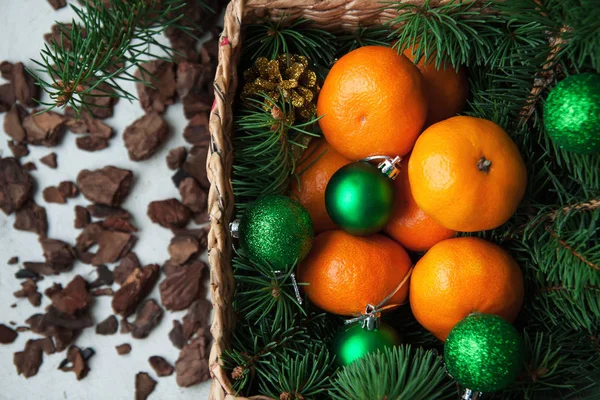 Christmas balls, tangerines and fir tree — Stock Photo, Image