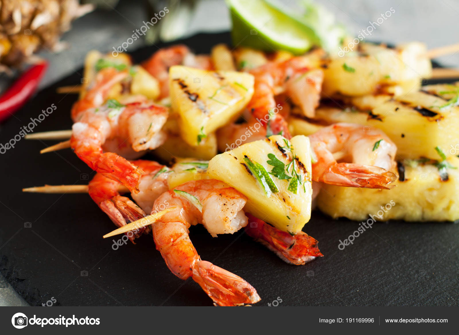 Grilled shrimp skewers with pineapple Stock Photo by ©filirochka 191169996