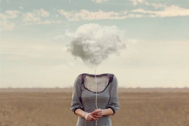 Woman's head hidden by a soft cloud clipart