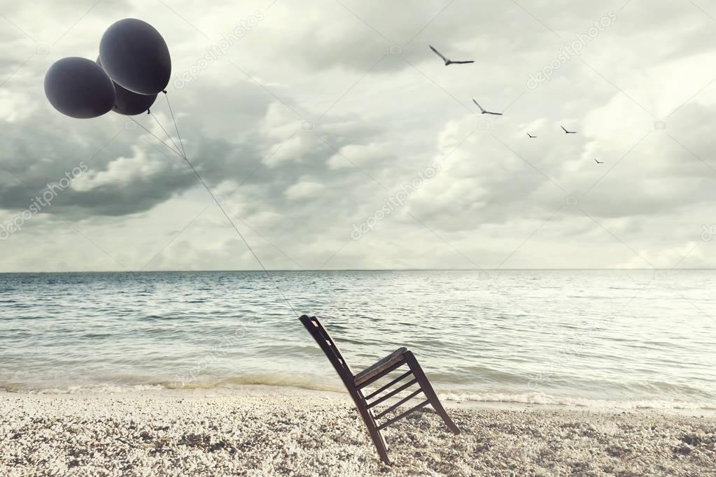 surreal image of a chair held in balance by flying balloons