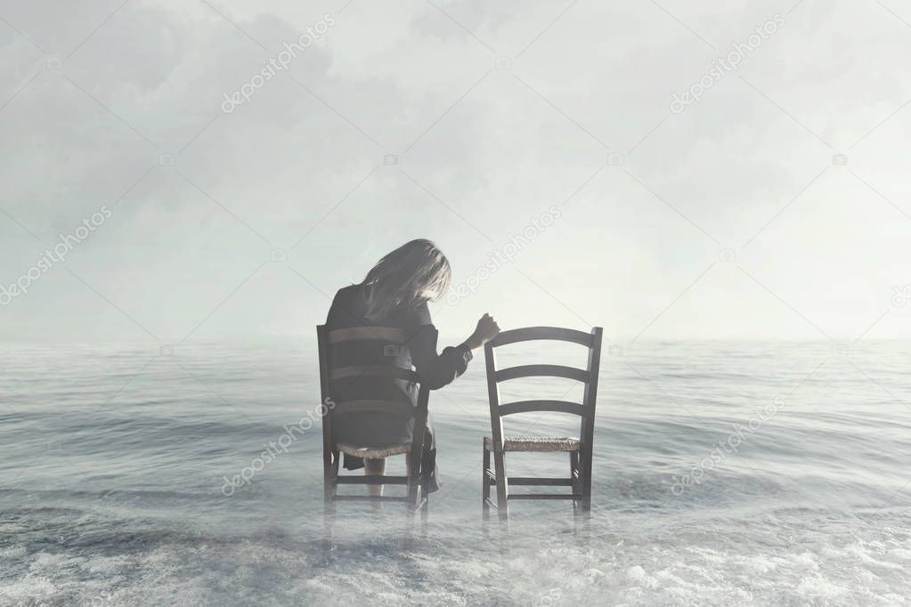 sad woman looks nostalgically at her lover's empty chair