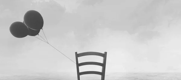 Solitairy 的椅子 黑色气球绑在海边 — 图库照片