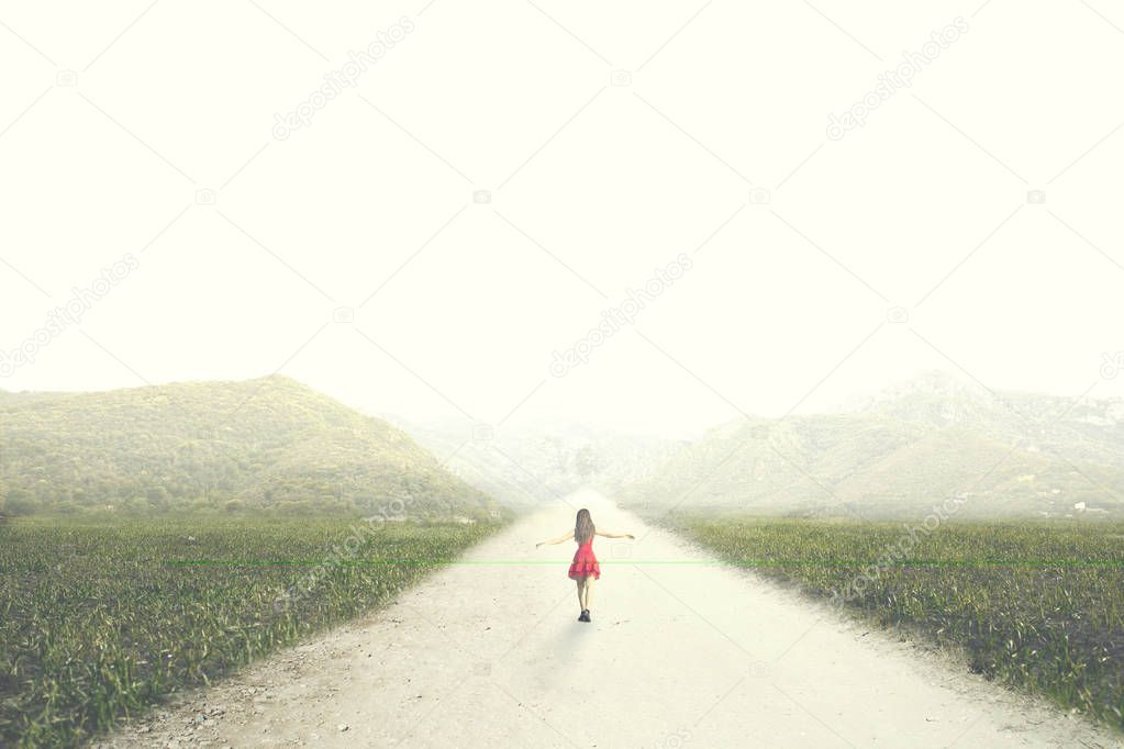 woman with red dress walks happy to infinity in the middle of nature