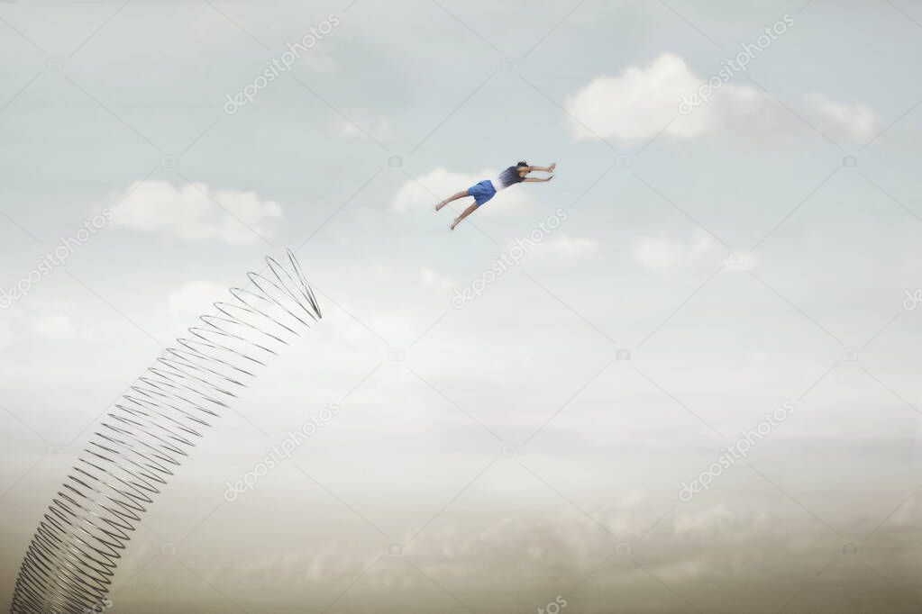 surreal boy launched from a spring in the sky