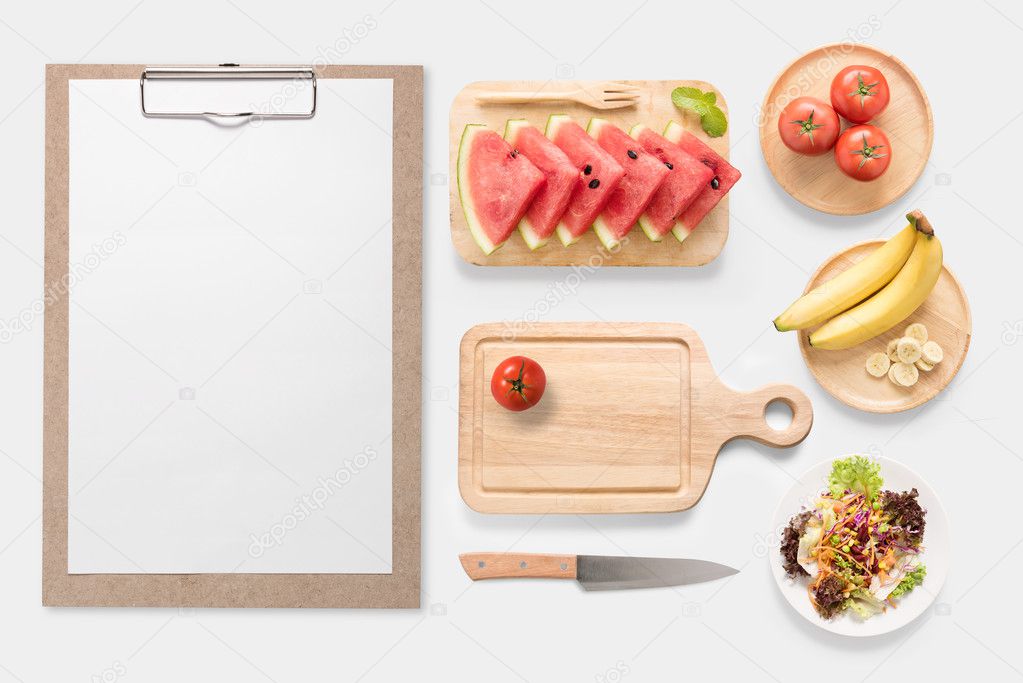 Design concept of mockup fresh vegetable, fruits and clip board set isolated on white background. Copy space for text and logo. Clipping Path included on white background.