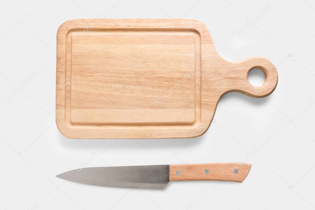 Mockup cutting board and knife set isolated on white background.
