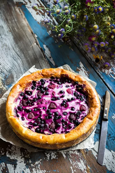 Homemade pie with bilberry on old wooden table. — Stock Photo, Image