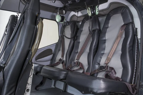 Helicopter interior safety belts and seats for passengers of Eurocopter luxury helicopter.