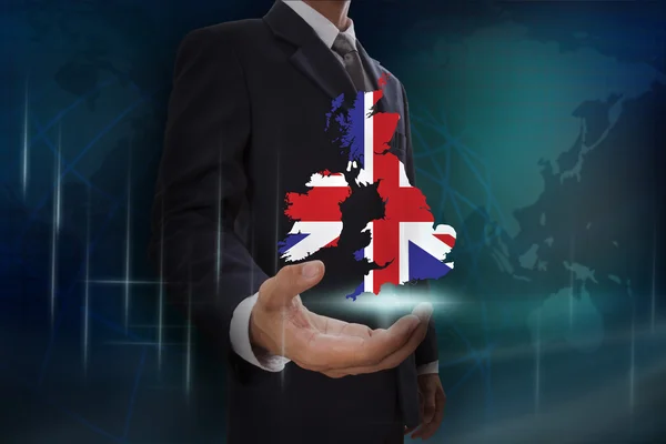 Podnikatel s mapou a vlajka Velké Británie — Stock fotografie