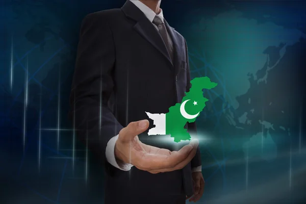 Podnikatel s mapou a vlajka Pákistánu — Stock fotografie