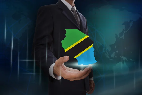 Geschäftsmann mit Landkarte und Flagge von Tansania — Stockfoto