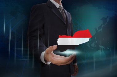 Harita ve Yemen bayrağı ile işadamı