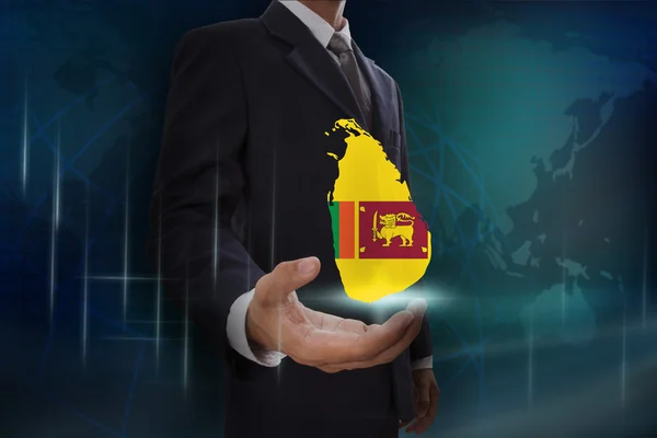 Бизнесмен с картой и флагом Шри-Ланки — стоковое фото