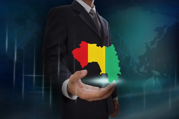 Businessman with map and flag of Guinea — Stock Photo, Image