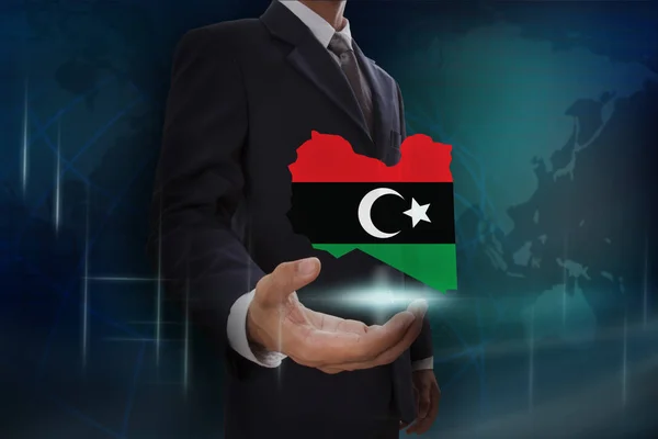 Biznesmen z mapą i flaga Libii — Zdjęcie stockowe