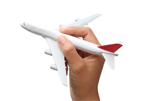 Hand holding a model plane on white background — Stock Photo, Image