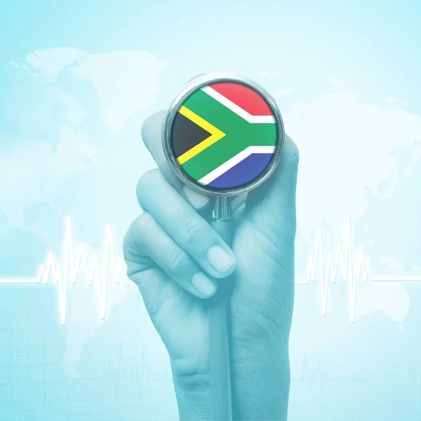 hand holding stethoscope with South Africa flag.