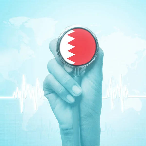 Hand of doctor holding stethoscope with Bahrain flag. — Stock Photo, Image