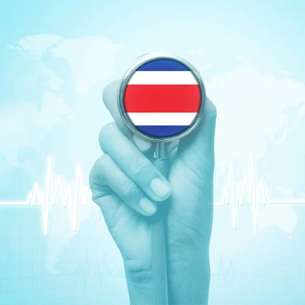 Hand holding stethoscope with Costa Rica flag. — Stock Photo, Image