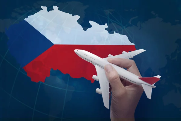 Hand holding airplane with map of Czech Republic. — Stock Photo, Image