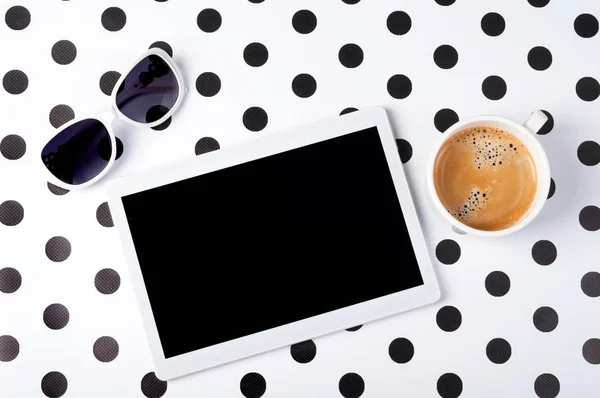 Female desk with tablet, coffee cup, sunglasses on creative background top view flat lay. Workplace freelance — Stock Photo, Image