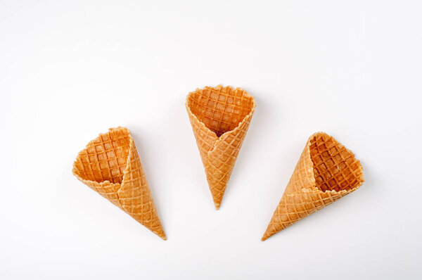 Ice cream cones on white. Pastry cones for summer dessert