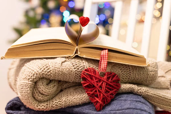 Valentine's Day background. Valentines heart made of book sheets. Valentines day red heart on book