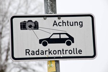 german language radar control sign warning car drivers about speed control. Text Translation 