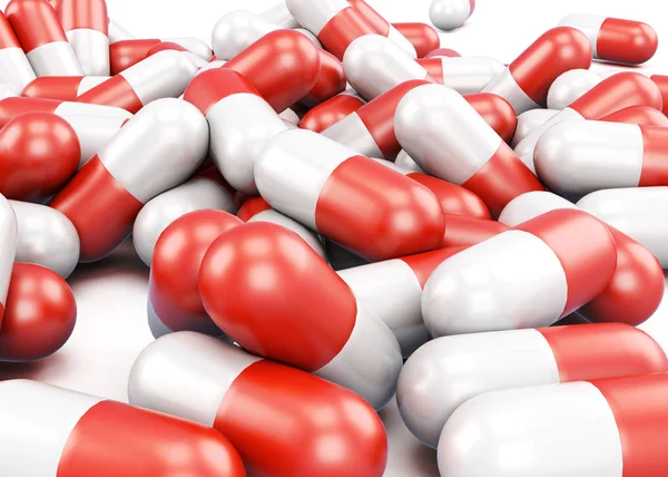 Червоні та білі таблетки крупним планом. 3D візуалізація — стокове фото