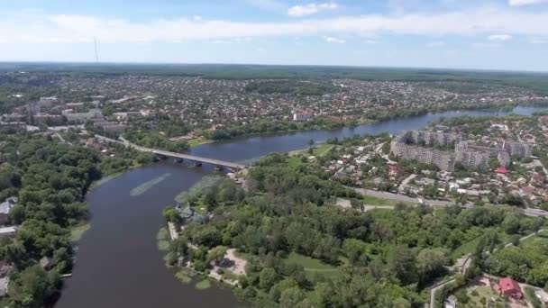 Aerial View. Flying over the city and bridge over the river — Stock Video