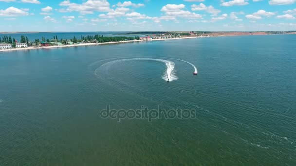 Water scooter move away to beach, aerial wide angle shot. — Stock Video