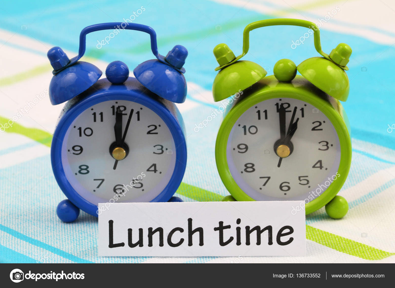 Lunch Time Card With Two Miniature Clocks Showing Twelve And One O Clock Stock Photo Image By C Graletta