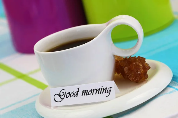 Good morning card with cup of black coffee and brown sugar stick — Stock Photo, Image